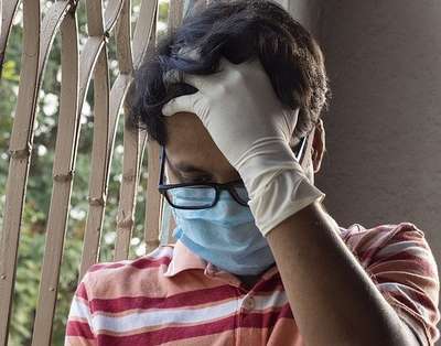 Boy wearing medical mask.