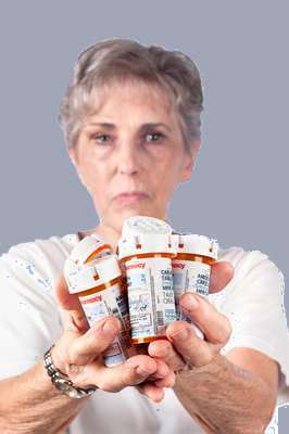 Woman with many prescription bottles